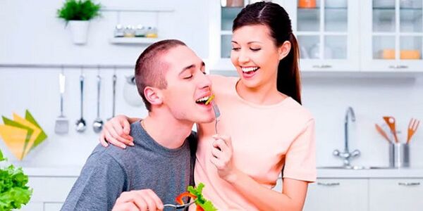 woman feeds man with products to increase potency